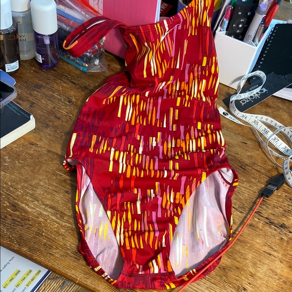 Nike Red Patterned Woman’s racer back Swimsuit NWOT. Size 36